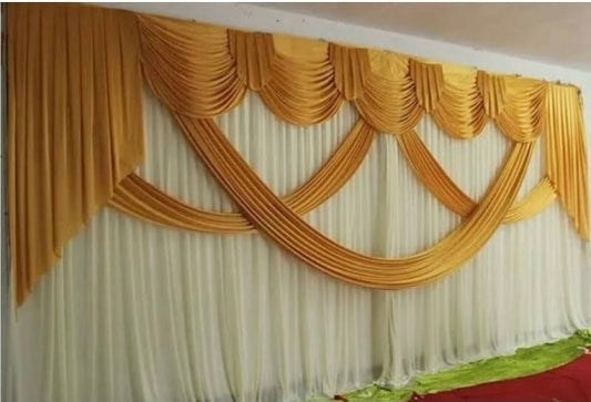 6m wide White and Gold swag backdrop for hire