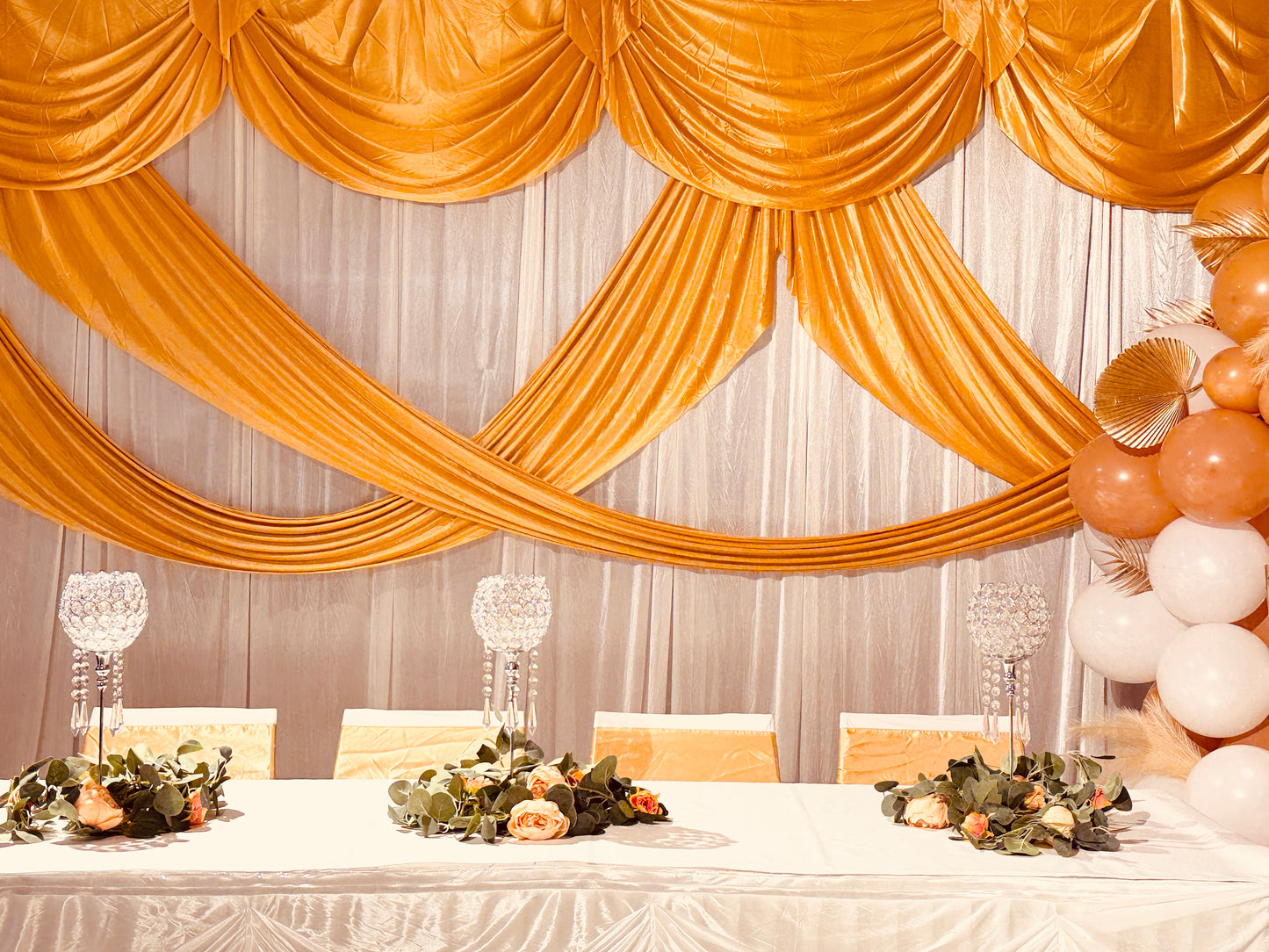 6m wide White and Gold swag backdrop for hire
