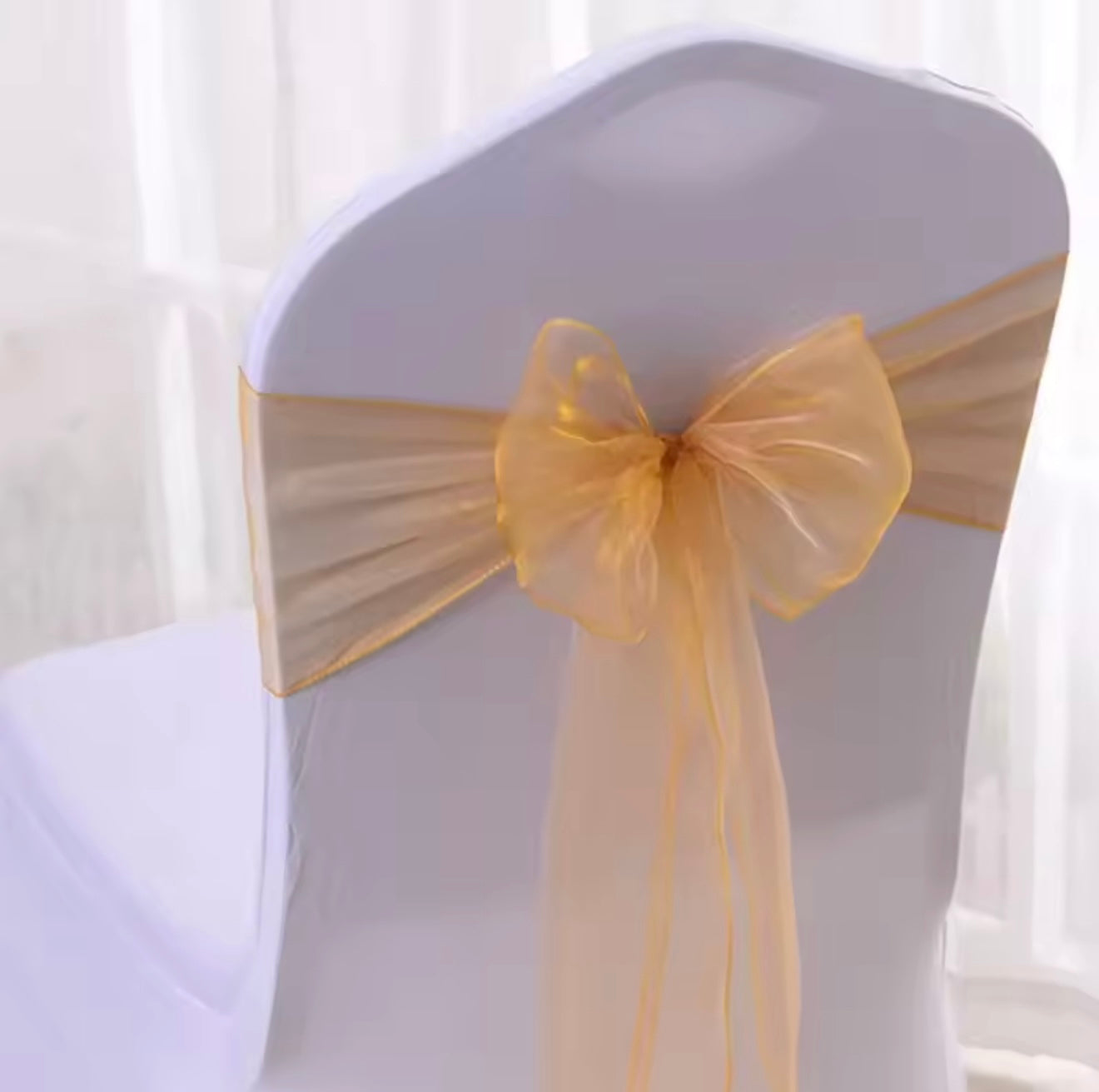 Golden organza chair sash or chair bow or chair tie for hire in Christchurch