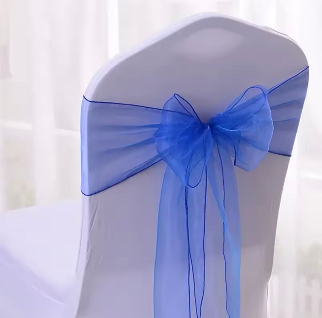 Blue organza chair sash or chair bow or chair tie for hire in Christchurch