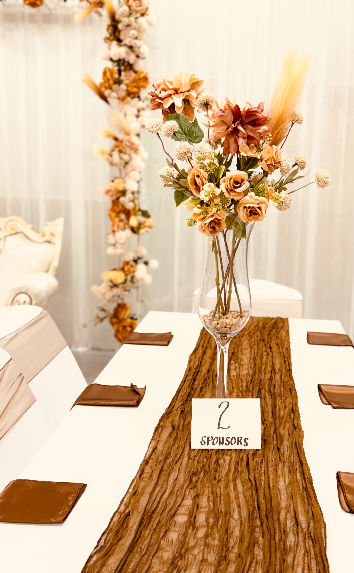 Wedding table centrepieces for hire in Christchurch (Waisted Flute Vases with Rustic Brown Floral Centrepieces)